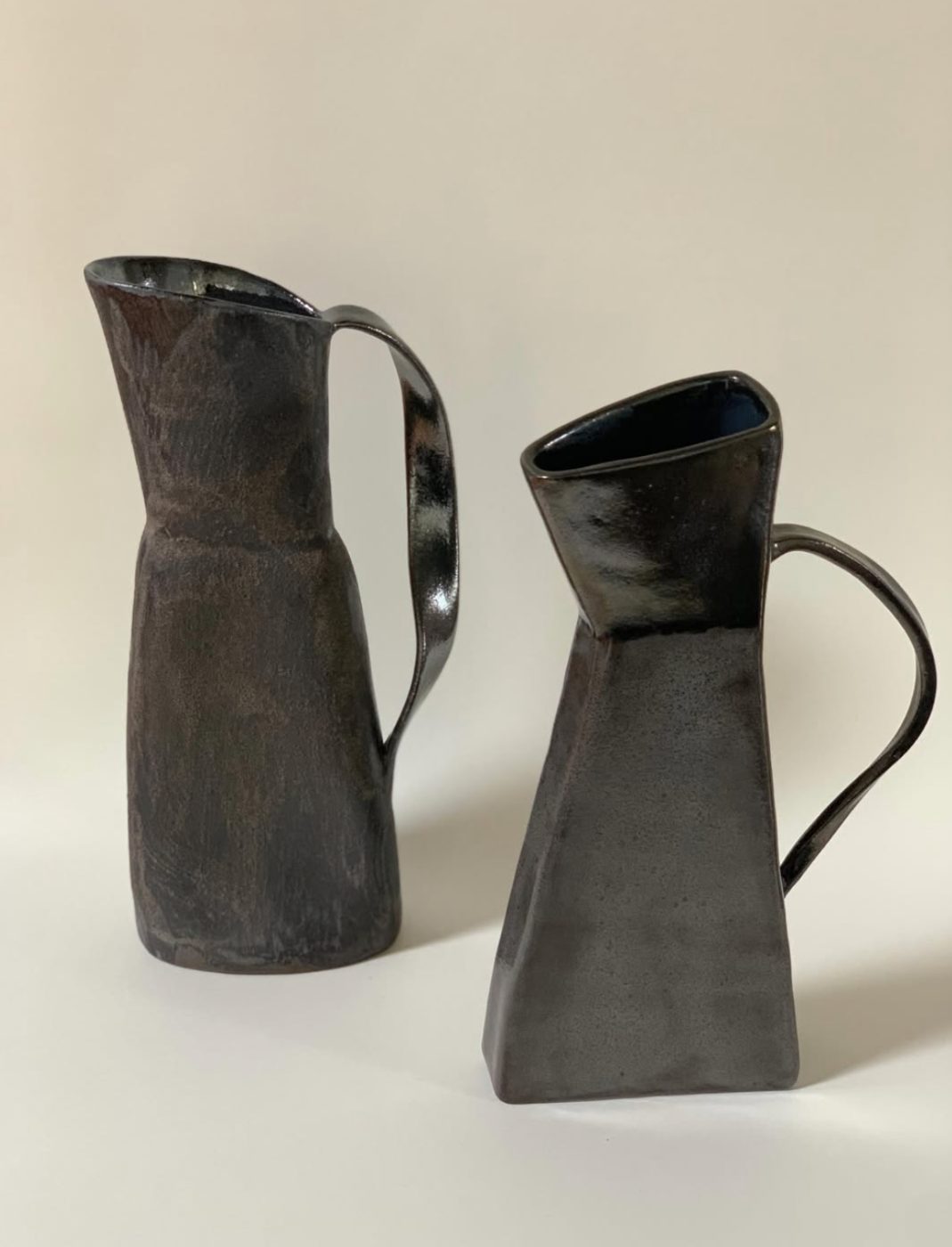 Two smoke-fired angular pitchers
