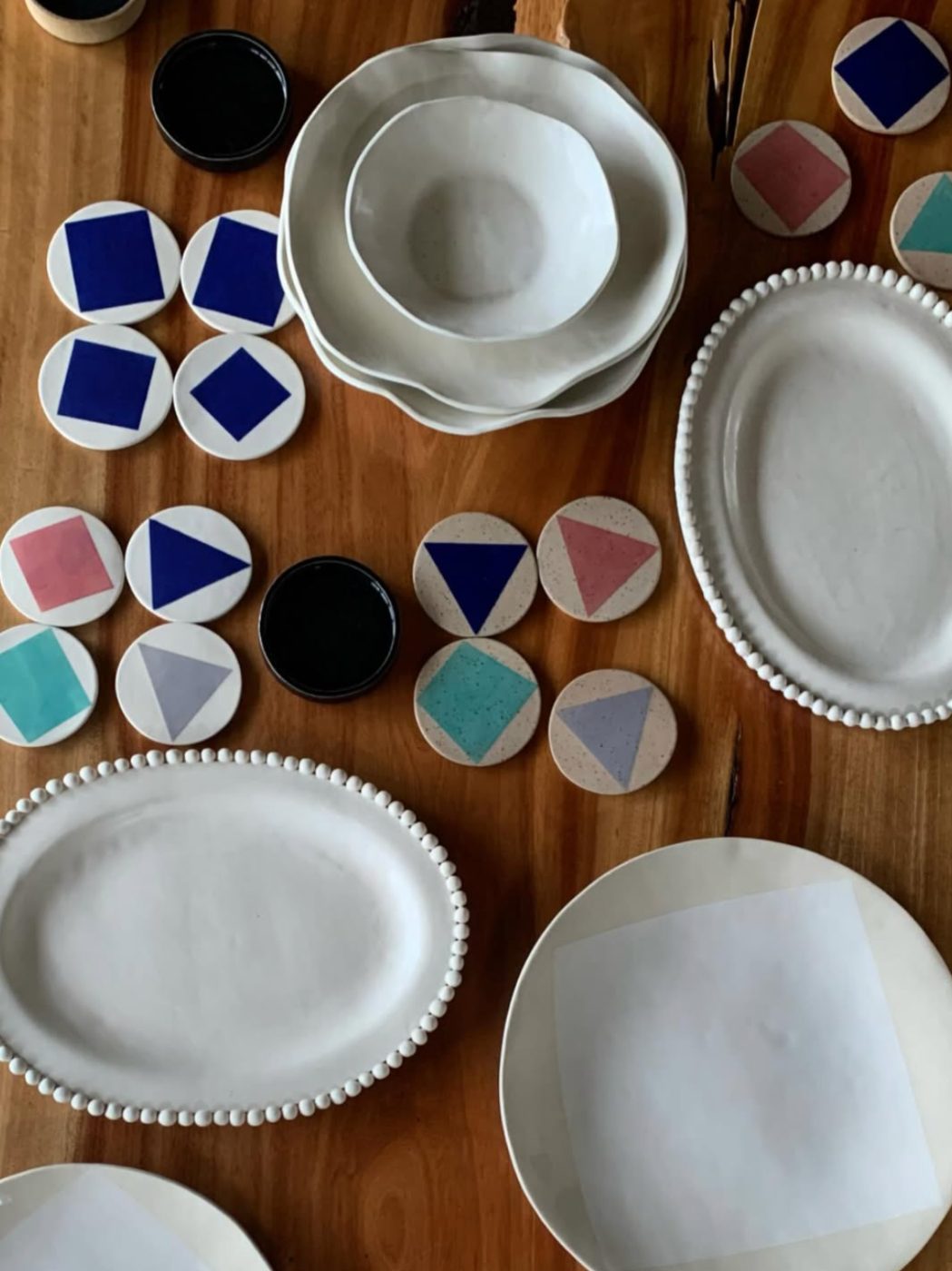 Table setting with geometric plates from above