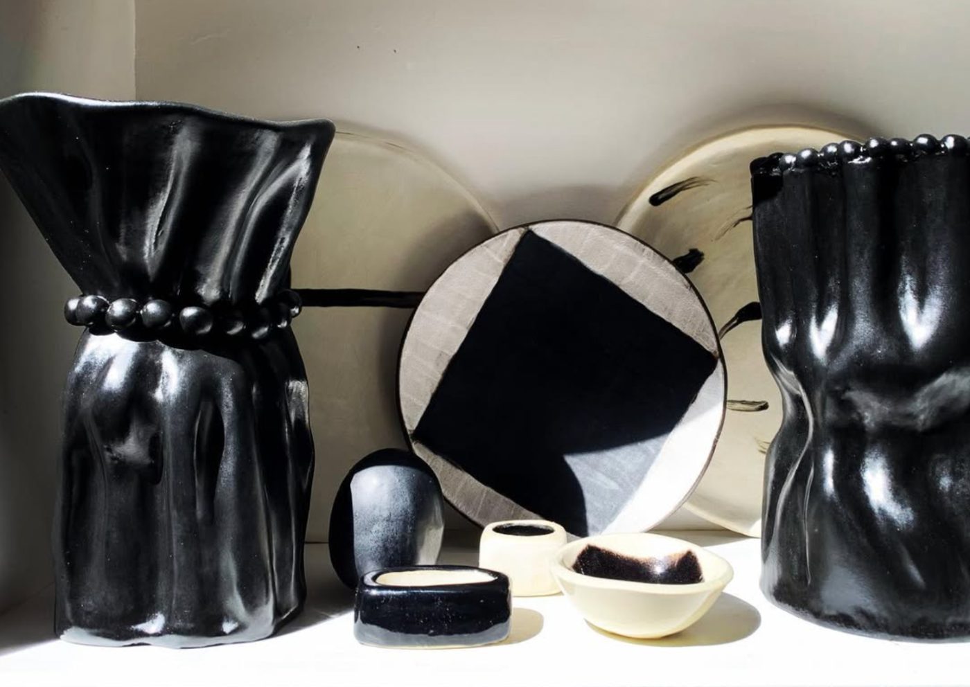 Gloss black draped vessels